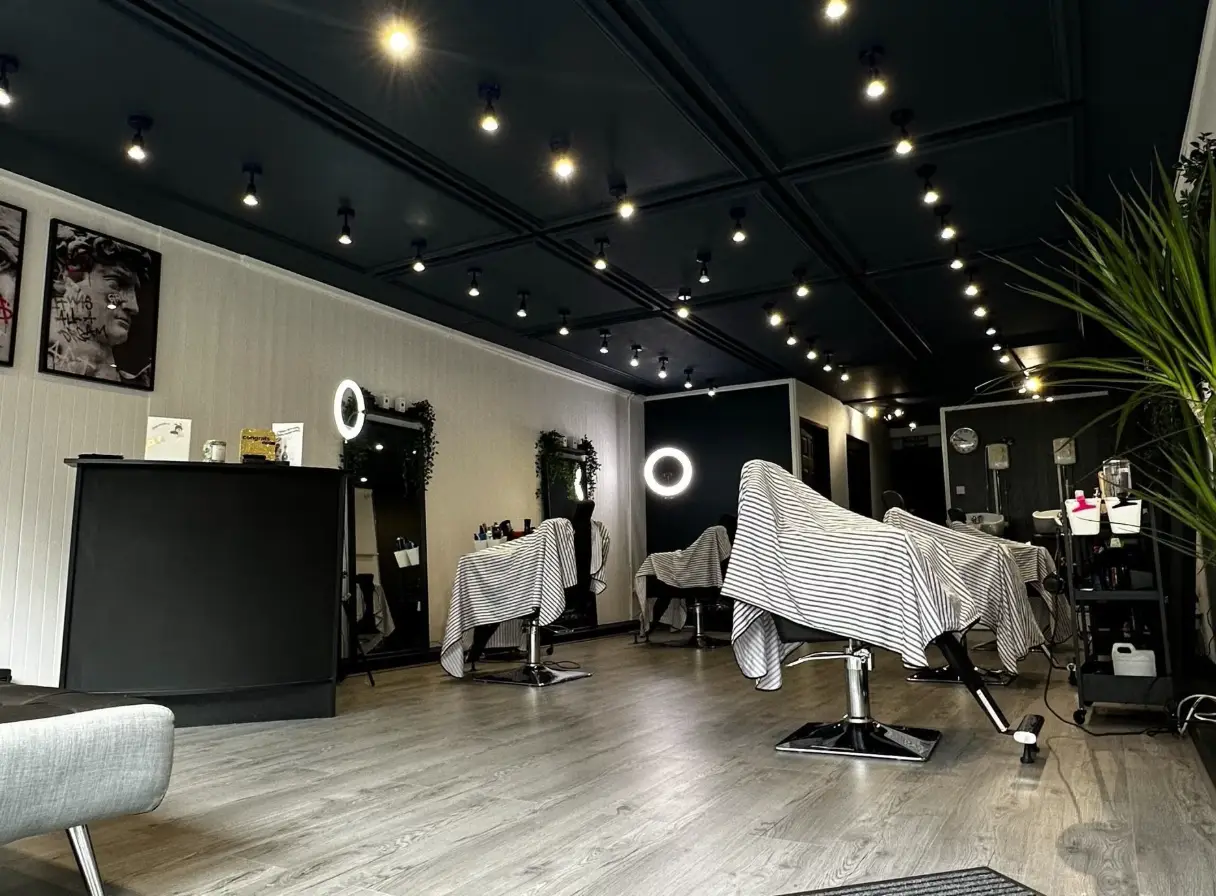 Barber and salon interior with styling chairs and ring lights